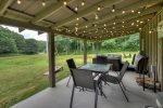 Covered Porch offers a patio set and a charcoal grill 